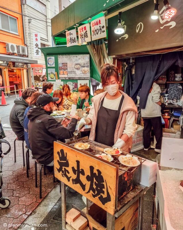 Kuromon Market in Osaka scallop seafood stall