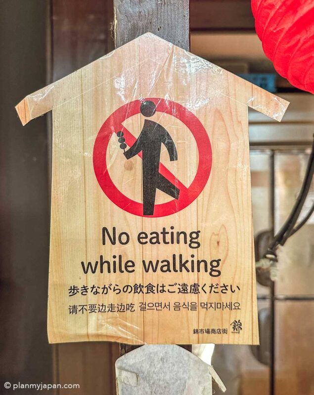 no walking while eating sign at Nishiki Market Kyoto Japan