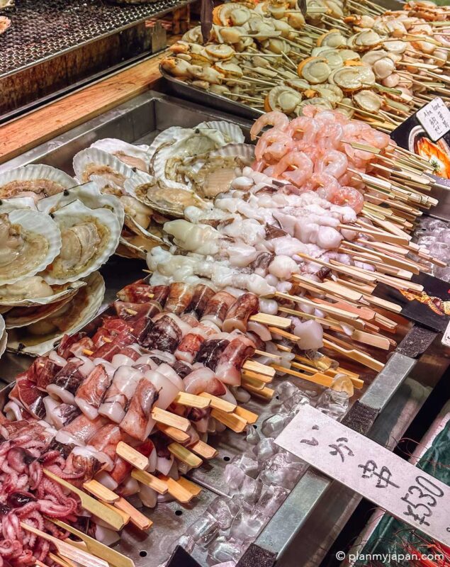 seafood skewer stall Nishiki Market Kyoto Japan